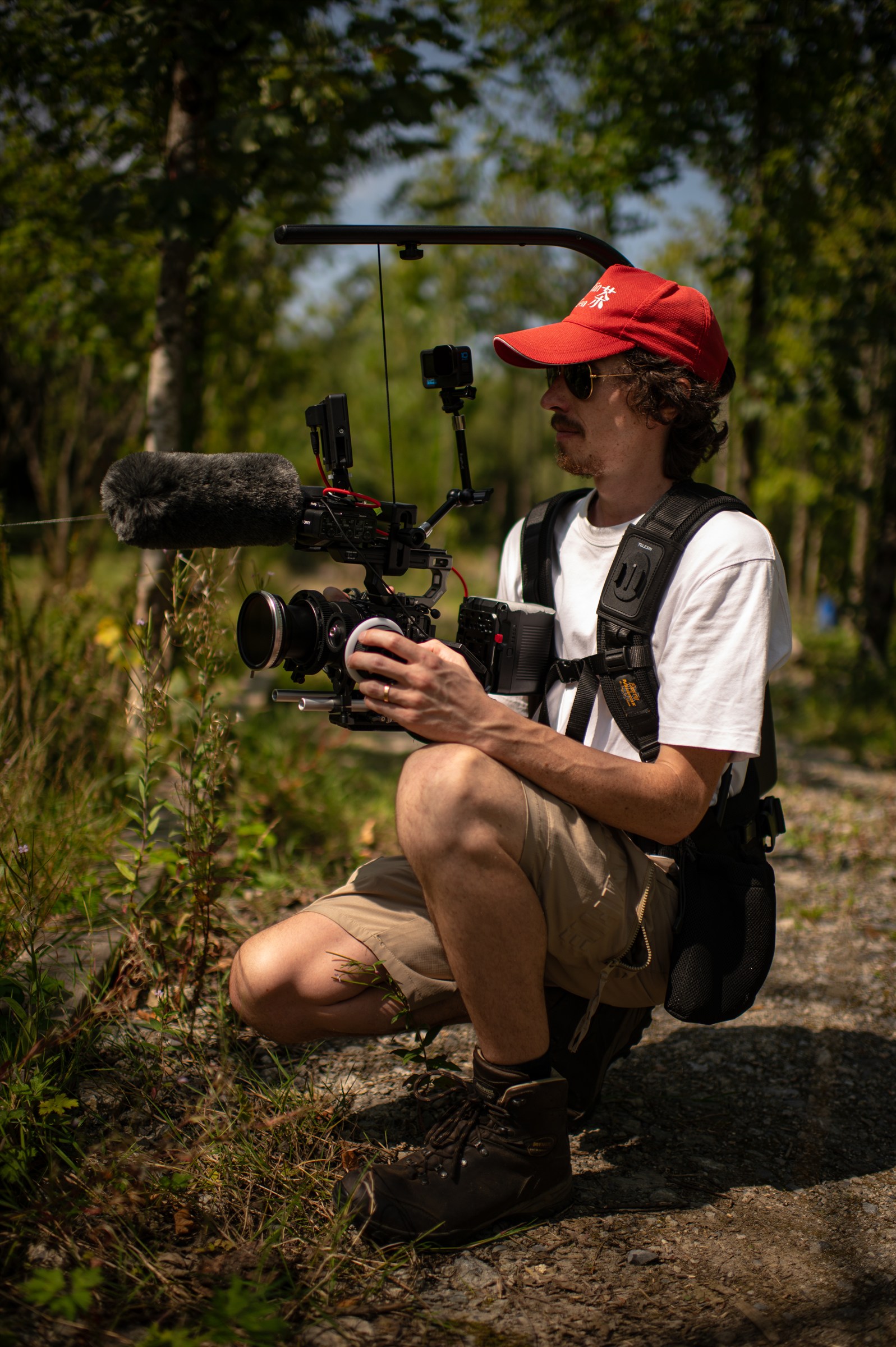 Shane Hatton operating a cinema camera during filming for Bosco's Garden Tour