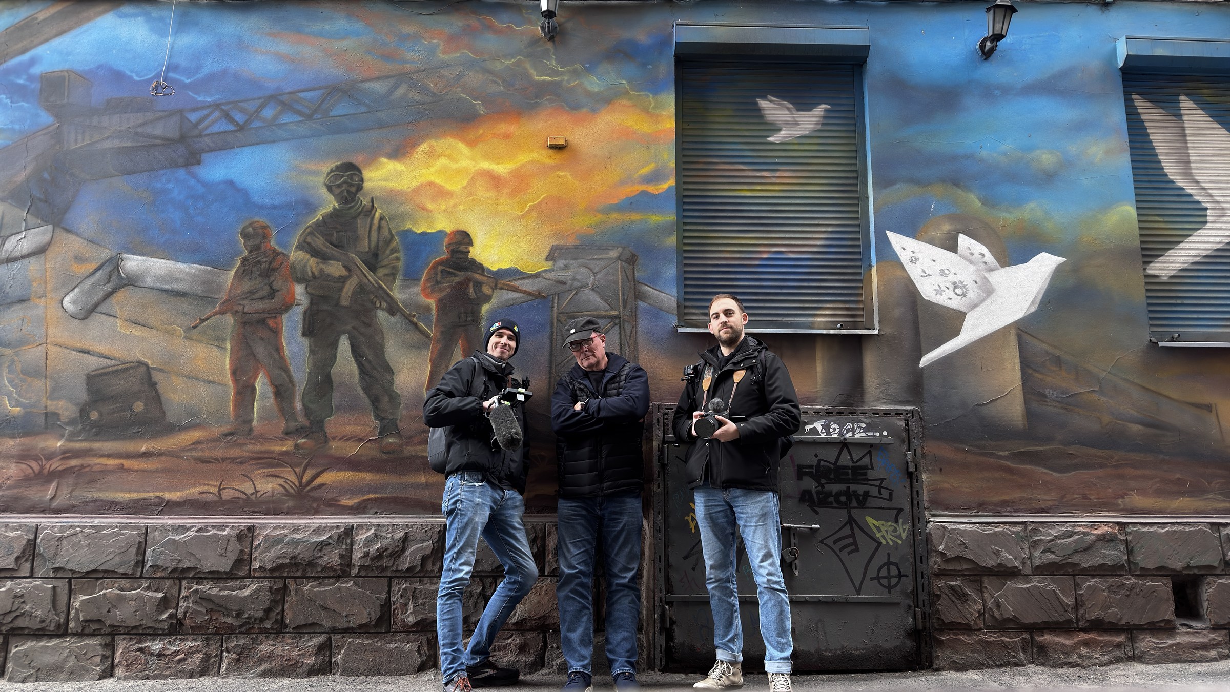 Members of the Shoulder to Shoulder production team with cameras in Ukraine